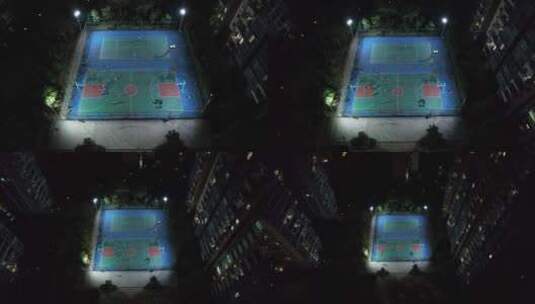 夜晚城市小区篮球场人们活动航拍高清在线视频素材下载