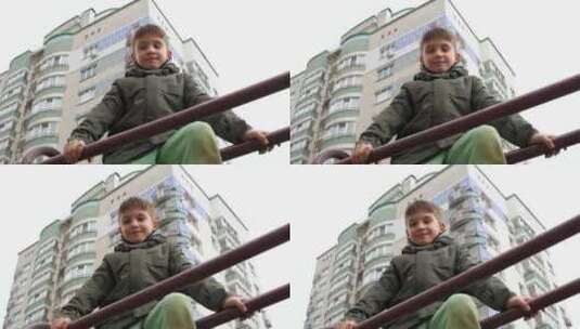 一个男孩坐在金属栏杆上的肖像，背景是板房高清在线视频素材下载