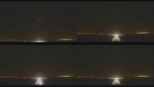 夜晚飞机降落在机场亮灯跑道 大兴机场高清在线视频素材下载