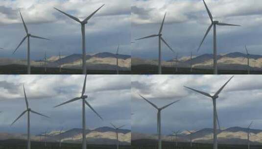山脚下的风力涡轮机在转动高清在线视频素材下载