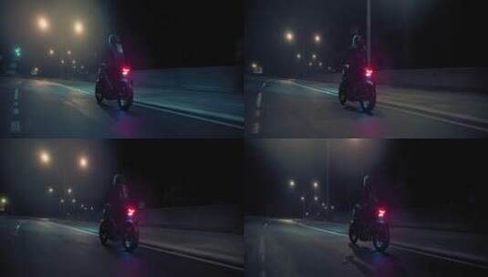 夜晚摩托车手在公路上骑行  高清在线视频素材下载