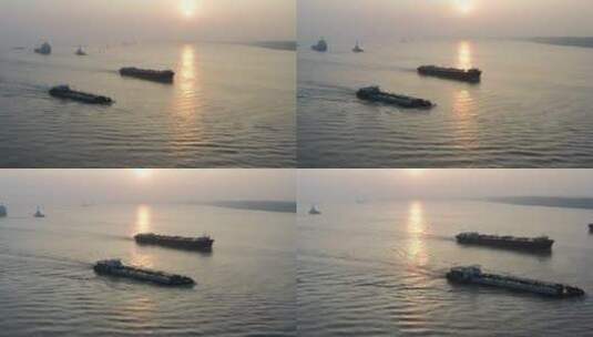 清晨海面唯美逆光下行驶的货船高清在线视频素材下载