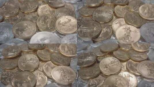 美国金鹰硬币在一堆银币上高清在线视频素材下载