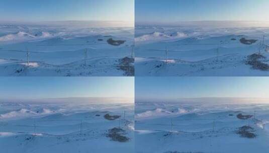 航拍建有风力发电风机的雪域雪原高清在线视频素材下载