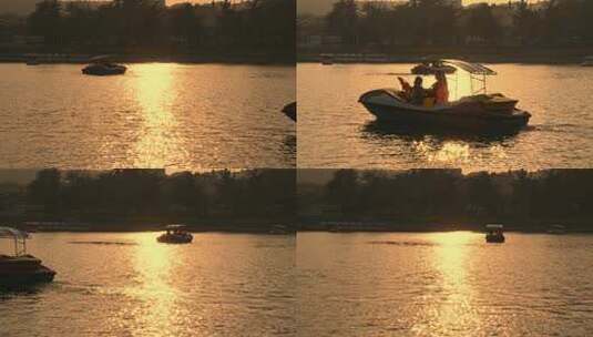 母亲和孩子在公园湖泊里一起划船亲子活动高清在线视频素材下载