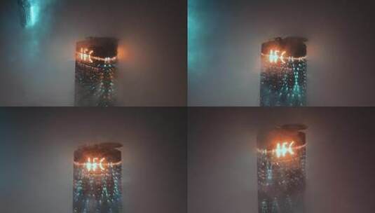 广州西塔黑夜烟雾中浪漫的灯光航拍4K视频高清在线视频素材下载