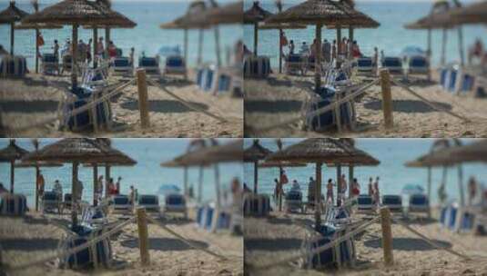一些游客在沙滩上游玩晒太阳高清在线视频素材下载
