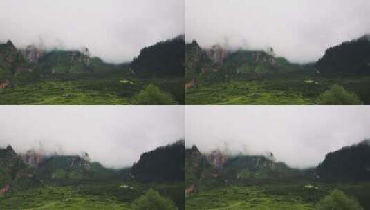 扎尕那云雾山峰下的村庄高清在线视频素材下载