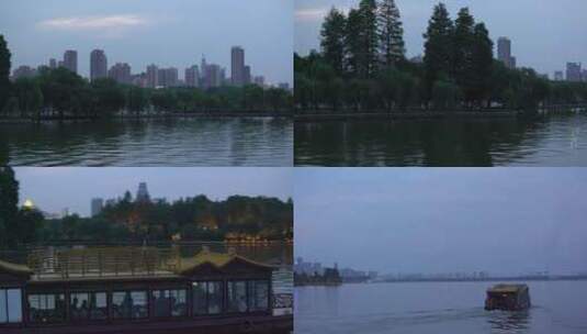 武汉东湖地拍傍晚湖边沿岸树木游船高清在线视频素材下载