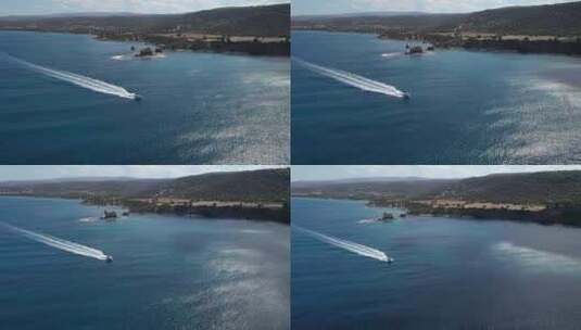 快艇经过金尾洲湾的阿卡马斯半岛，空中跟踪高清在线视频素材下载