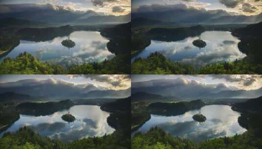 日出时阳光照射斯洛文尼亚布莱德湖岛时的山地景观高清在线视频素材下载