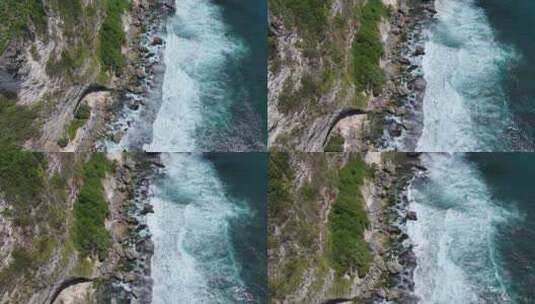 航拍印度尼西亚巴厘岛悬崖边下的绿松石大海高清在线视频素材下载