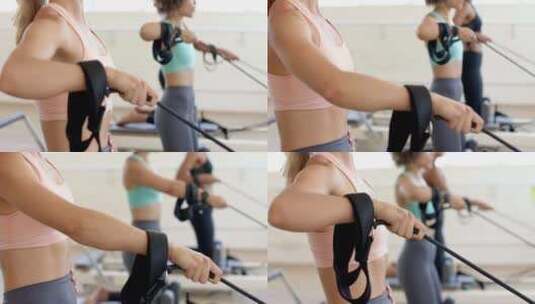 一群女人专注于锻炼，在健身房的划船机上锻高清在线视频素材下载