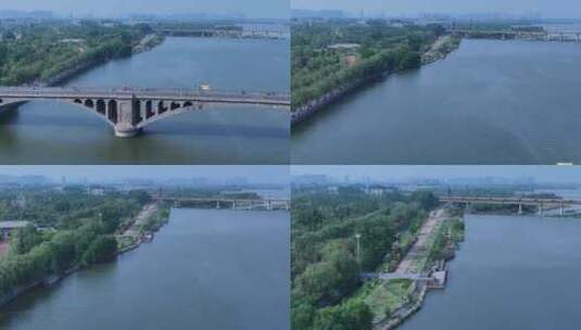 城市绿化河流铁路桥火车经过高清在线视频素材下载
