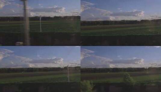 火车行驶中窗外的风景，蓝天白云，绿草地高清在线视频素材下载