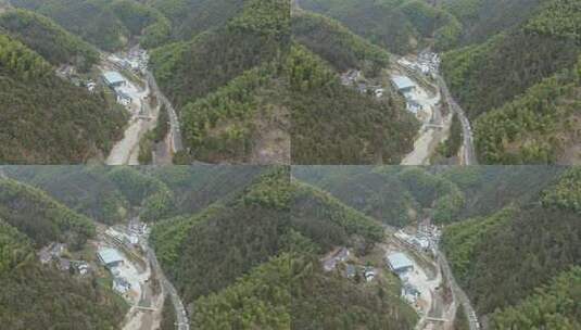 山林间的村庄及蜿蜒道路鸟瞰全景高清在线视频素材下载