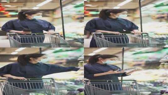 年轻女性在现代商超购物逛超市高清在线视频素材下载