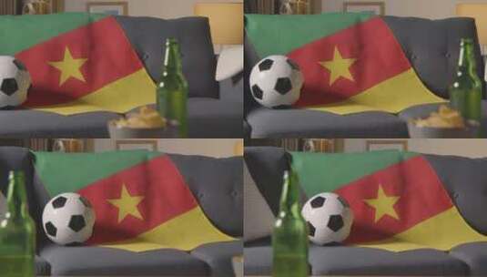 沙发上的喀麦隆国旗和足球特写高清在线视频素材下载