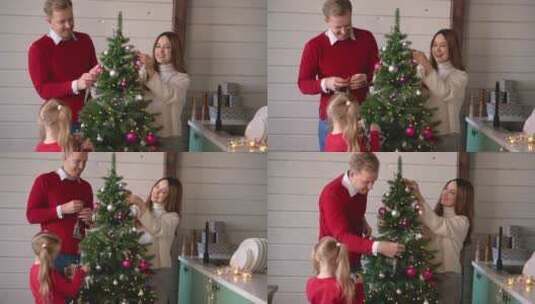 父母和女儿一起装饰圣诞树高清在线视频素材下载