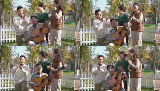 中老年人在房车露营院子里聚会弹吉他唱歌高清在线视频素材下载