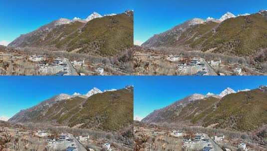 航拍四姑娘山双桥沟雪山下的藏式村寨民居高清在线视频素材下载
