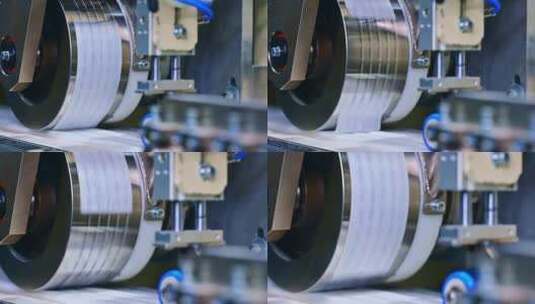 生产尿布的工厂在专用机器上生产大批量尿布高清在线视频素材下载