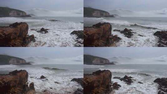 海浪拍打着岩石的壮阔海边景象高清在线视频素材下载