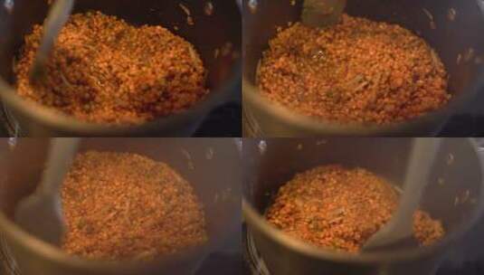 在平底锅里搅拌小扁豆的特写镜头高清在线视频素材下载
