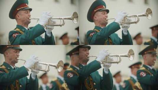 俄罗斯，喀山09-08-2019：管乐器游行——一名身穿绿色服装的男子吹小号高清在线视频素材下载