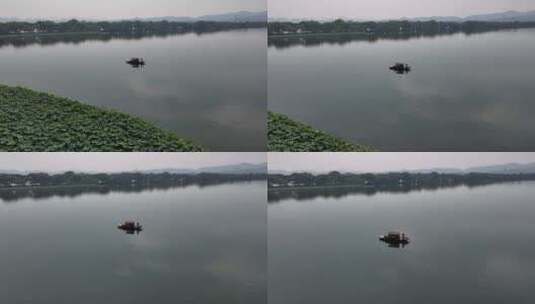 航拍杭州西湖摇橹船手划船高清在线视频素材下载
