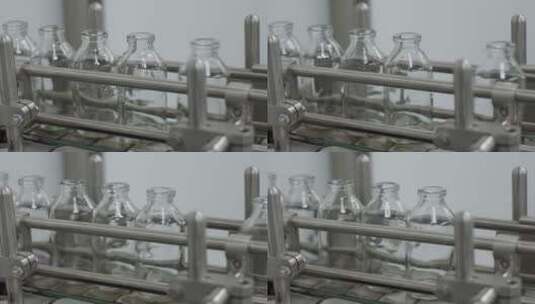 医疗溶液输送线上的玻璃瓶特写高清在线视频素材下载