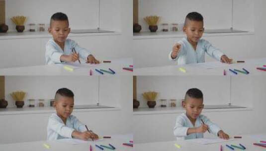小男孩在家用彩色铅笔画画高清在线视频素材下载