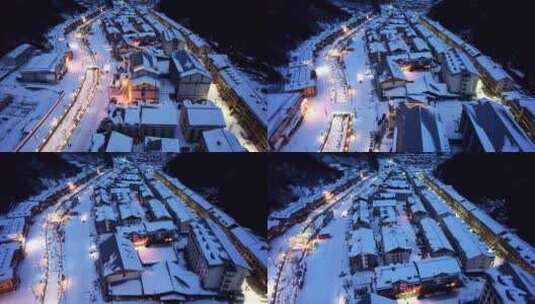 航拍冬天山川村庄房屋道路夜晚雪景高清在线视频素材下载