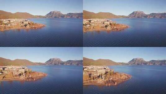 云南泸沽湖大落水村和格姆女神山清晨航拍高清在线视频素材下载