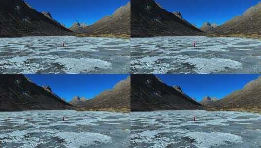 高山湖泊间蜿蜒道路的自然风光高清在线视频素材下载