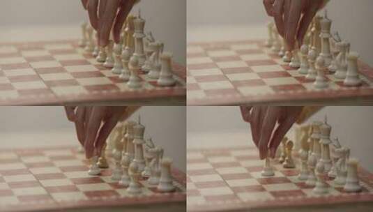 人的手把棋子在棋盘格上移动高清在线视频素材下载