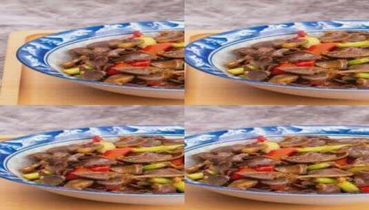 芹菜炒鸡杂美食菜品4k竖版滑轨平移高清在线视频素材下载