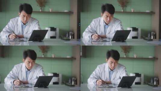年轻医学科研人员文件夹抄写记录笔记本内容高清在线视频素材下载