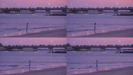傍晚一个少年在海边晚霞中自拍高清在线视频素材下载