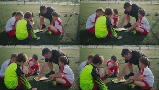 教练在指导孩子踢足球技巧高清在线视频素材下载