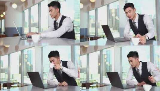 一位商务人士边工作边喝咖啡高清在线视频素材下载