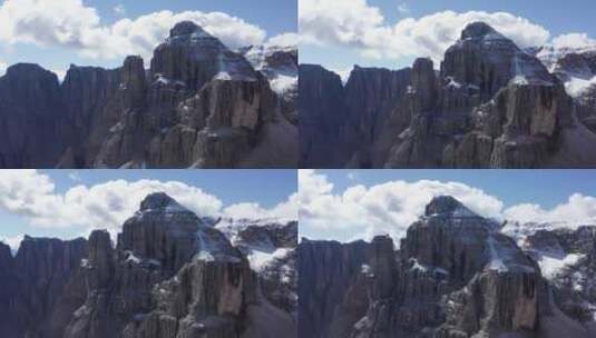 无人机飞向意大利阿尔卑斯山白云石山顶积雪覆盖的壮观山峰高清在线视频素材下载