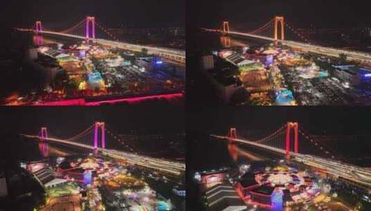 航拍宜昌至喜大桥夜景和西坝夜市高清在线视频素材下载