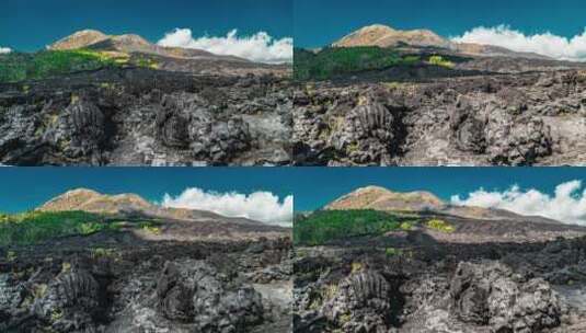 印度尼西亚巴厘岛巴图尔火山黑色熔岩的戏剧性景象。延时高清在线视频素材下载