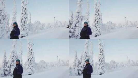 女孩走在街上，探索芬兰拉普兰美丽的白雪覆高清在线视频素材下载