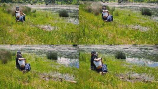 河边草地上情侣依偎着高清在线视频素材下载