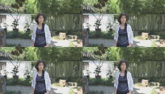 阳光下江南园林惬意度假的时尚美女高清在线视频素材下载