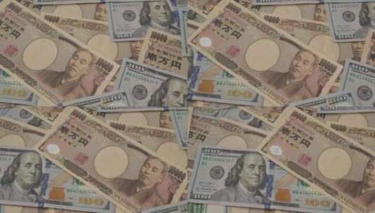 一叠美元和日元钞票高清在线视频素材下载