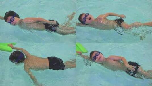 男孩子在游泳课锻炼中训练在水中呼吸高清在线视频素材下载