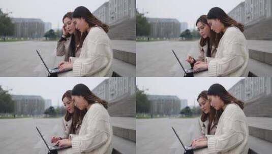 美女大学生在校园使用笔记本电脑高清在线视频素材下载